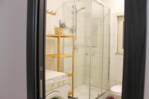a bathroom with a shower and a toilet at Casa Nilde in Siculiana