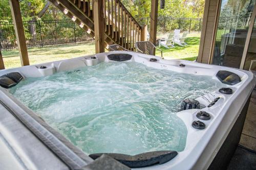 a jacuzzi bath tub with water in it at Stunning 5BR Villa Large Hot Tub & Scenic Yard in Bennington