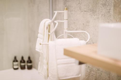 a bathroom with towels hanging on a towel rack at Duomo Florence - Esclusive Luxury in Florence