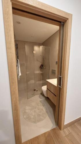 a bathroom with a shower and a toilet and a sink at Piscinas, Serra da Estrela AL in Bouça