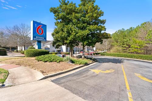 a gas station sign on the side of a road at Studio 6-Duluth, GA - Atlanta - Gwinnett Place in Duluth