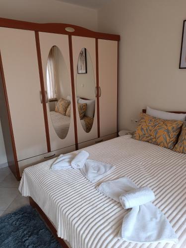 a bedroom with a bed with towels on it at joanna's house in Alexandroupoli