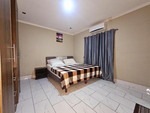 Postel nebo postele na pokoji v ubytování 2bedroom Deluxee Apartment