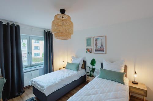 Postel nebo postele na pokoji v ubytování Atlas Apartment Essen, 3 Zimmer, Uniklinik, Messe, Parkplatz, Balkon
