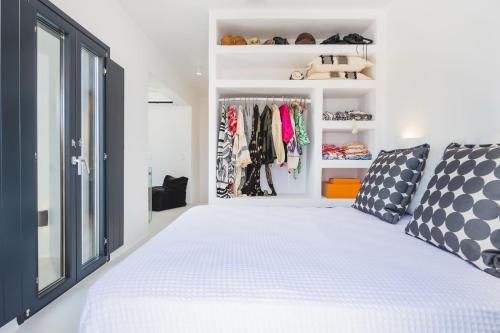a bedroom with a bed and a closet at VotsaLo sea view house in Kastraki