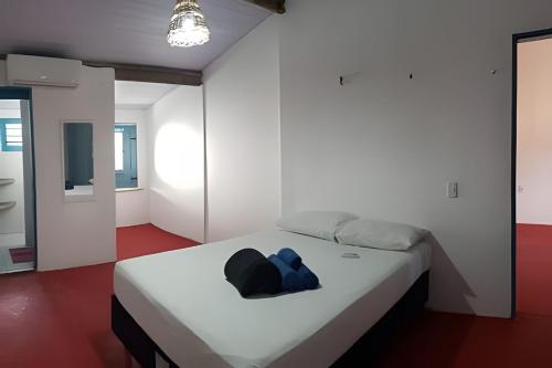 Letto o letti in una camera di Casa na praça de BG - 200 metros da praia