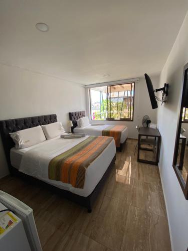 Postel nebo postele na pokoji v ubytování Samalá Casa Hotel