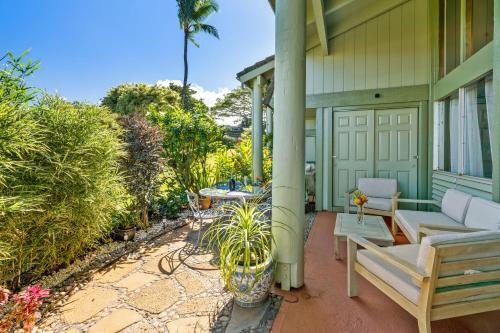 a patio with a couch and a table on a house at (P17D) Hale Blue Hawaii 1Br with Loft, Puamana, Pool, Wifi in Princeville