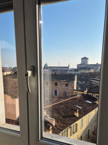 a view of a city from a window at Home La Torre next the station in Chiari