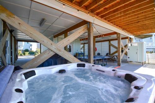 a jacuzzi tub in the middle of a house at Ocean Sounds in West Onslow Beach