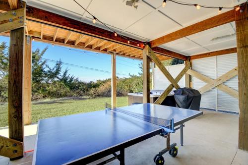a ping pong table in a pavilion at Ocean Sounds in West Onslow Beach