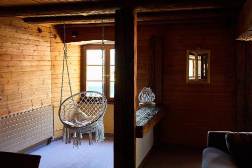a room with a rattan chair and a window at Bed & Breakfast Müllers Klostermühle in Münstertal