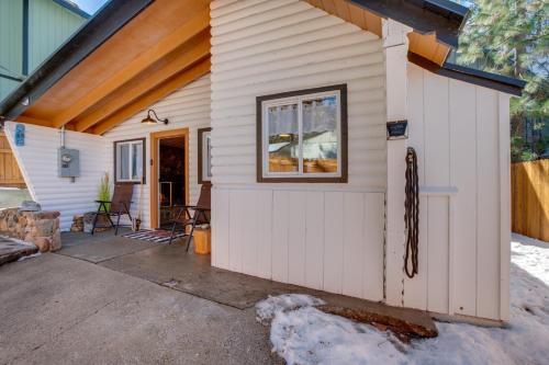 a small white shed with a window at Walk to Beach Dog-Friendly Cabin in Glenbrook! in Glenbrook