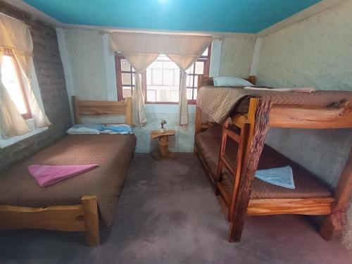 Postel nebo postele na pokoji v ubytování Casa Pukyu Pata