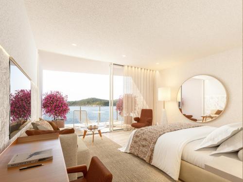 a bedroom with a large bed and a large window at Villa Dubrovnik in Dubrovnik