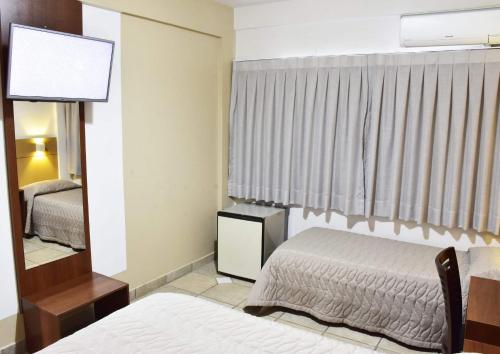 Postel nebo postele na pokoji v ubytování Campo Palace Hotel
