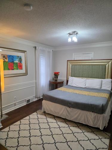 a bedroom with a bed in a room at Modern Vast Southern Home with Pool Near Shops in Memphis