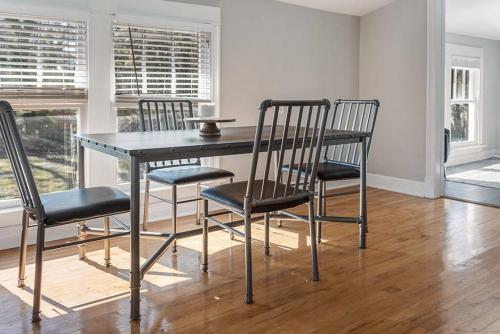 a dining room table and chairs in a room at Old Dauphin Way Historic Home - Unit 3 in Mobile