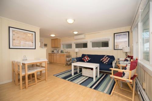 a living room with a couch and a table at The Montauk Soundview in Montauk