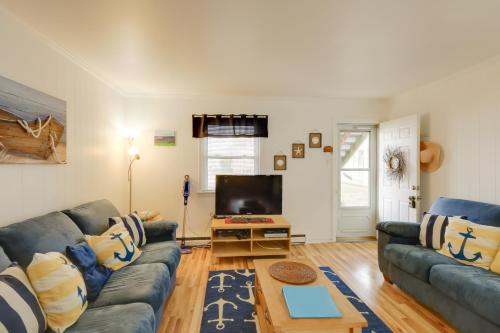 a living room with a couch and a tv at Bay Access The English Condo in Ocean City in Ocean City