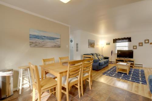 a dining room and living room with a table and chairs at Bay Access The English Condo in Ocean City in Ocean City