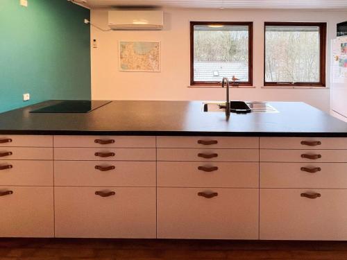 a kitchen with a sink and a counter at 6 person holiday home in Asperup in Asperup