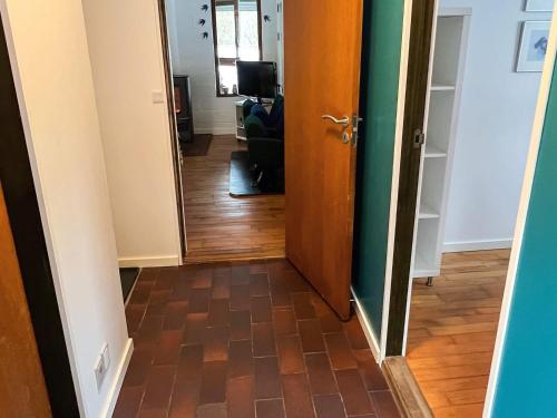 a hallway with a door leading to a living room at 6 person holiday home in Asperup in Asperup