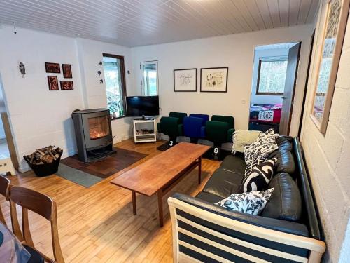 a living room with a couch and a table at 6 person holiday home in Asperup in Asperup