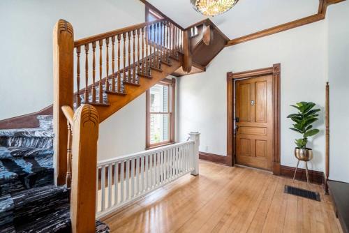 a staircase in a home with wooden floors at Grand Harbor Apartments 3 - 200 in Grand Haven