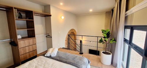 a bedroom with a bed and a window at Casa 8 in Guadalajara