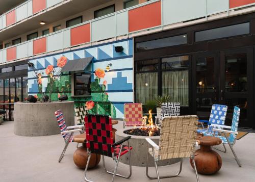 a group of chairs around a table with a fire pit at ARRIVE Albuquerque in Albuquerque