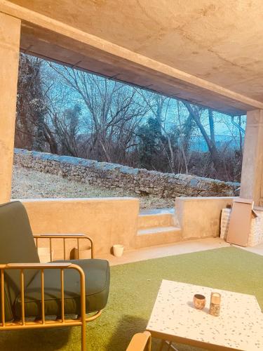 a living room with a couch and a table at Zen & Nature au Centre Ville in Audun-le-Tiche