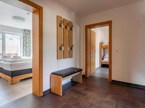 a room with a bedroom with a bed and a mirror at Ferdinand in Hirnreit