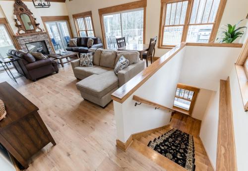 a living room with a couch and a table at Snug Cabin with Hiking Trail and Private Lake Access in Grand Junction