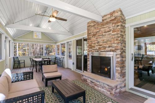 a living room with a fireplace and a couch at Snug Cabin with Hiking Trail and Private Lake Access in Grand Junction