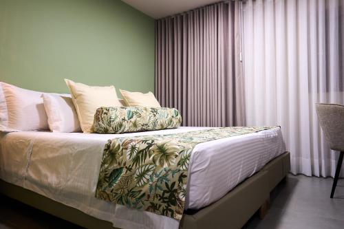 Cama o camas de una habitación en Kamaleb Farallones Hotel