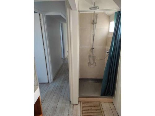 a bathroom with a shower with a shower curtain at Holiday home for 8 people in Veulettes-sur-Mer