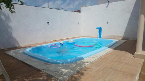 a swimming pool in the middle of a room at Recanto do Ze Bonito in Conde