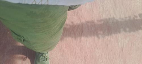 a person wearing a green shirt and green shorts at Hostal Mari sabina in Bucerías