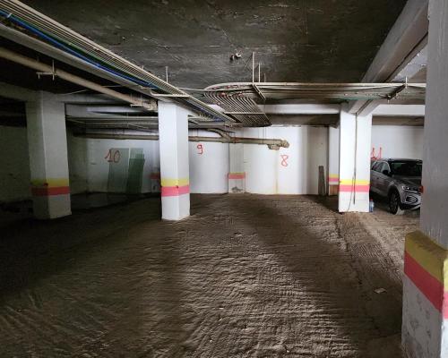 an empty parking garage with a car parked in it at Luxury Vista Mar Apartment in Martil