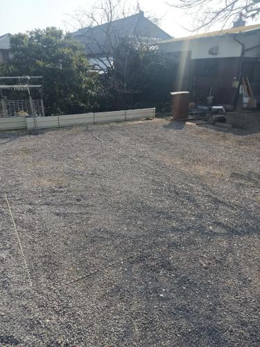 a yard with a fence and a building at Guest House Ihatov - Vacation STAY 33059v in Takamatsu