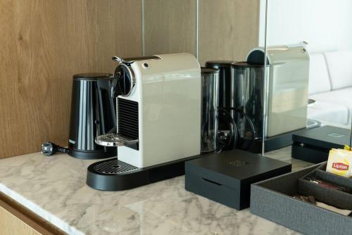 a white mixer sitting on a counter in a room at Stanford hotel Andong in Andong