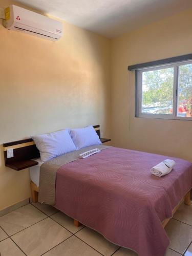 Postel nebo postele na pokoji v ubytování Departamento con terraza