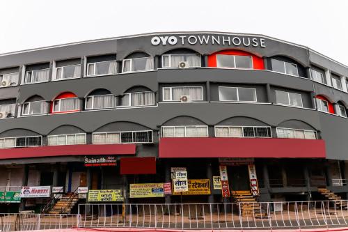 an apartment building with an omo townhouse sign on it at Super Townhouse Gandhi Hall in Indore