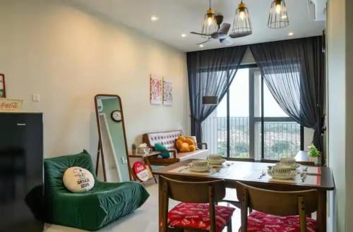 a living room with a table and chairs and a window at 1506 SkyTree Bukit Indah Aeon 1min in Johor Bahru