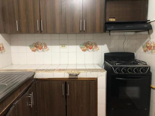 Kuchyň nebo kuchyňský kout v ubytování Apartamento cerca a Parque de Bello Antioquia