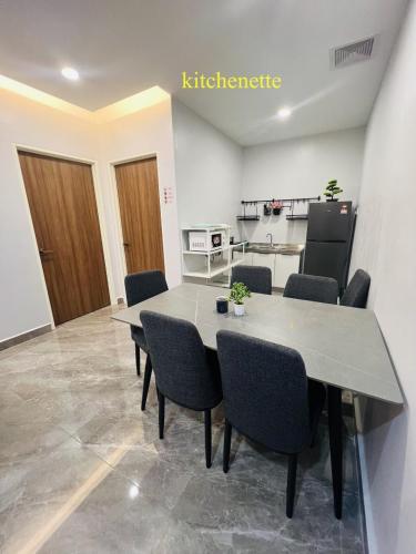 a dining room with a table and chairs at A1 Hotel Sungai Petani in Sungai Petani