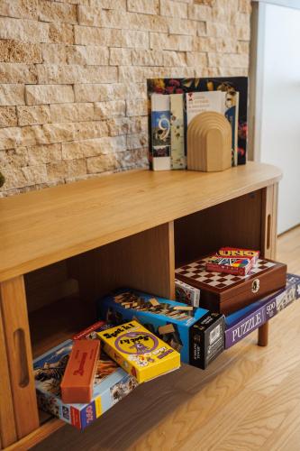 a wooden shelf with pizza boxes on it at Dosoftei Residence in Chişinău
