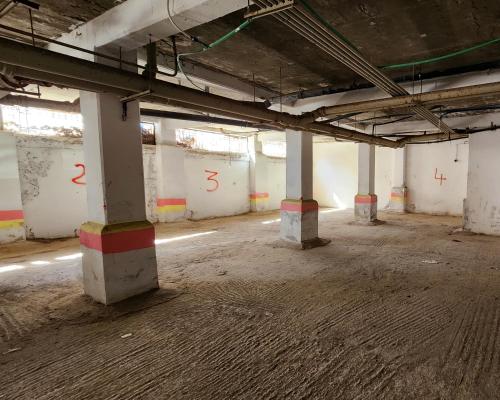 an empty room with columns in an empty building at Vista bella luxurious apartment in Martil