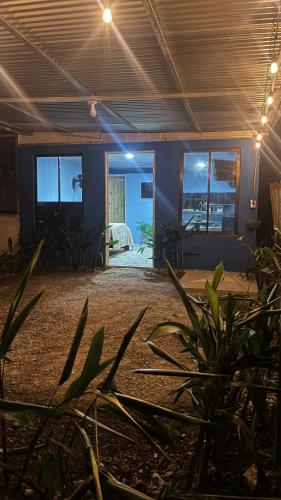 a room with plants in the middle of a room at Osa House in Puerto Jiménez